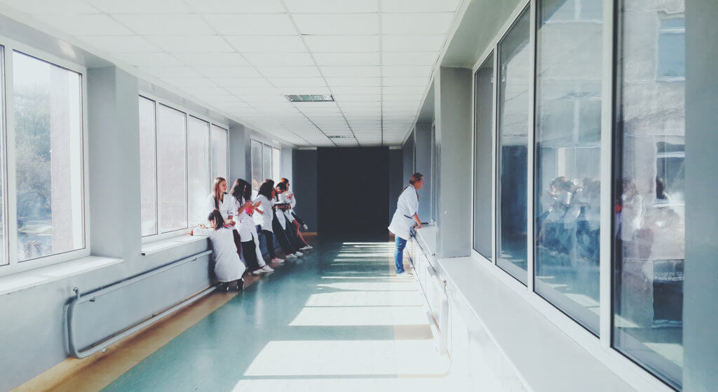 Healthcare professionals standing in a hallway